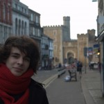 A tourist poses alone in St. Mary's Street, Cardiff