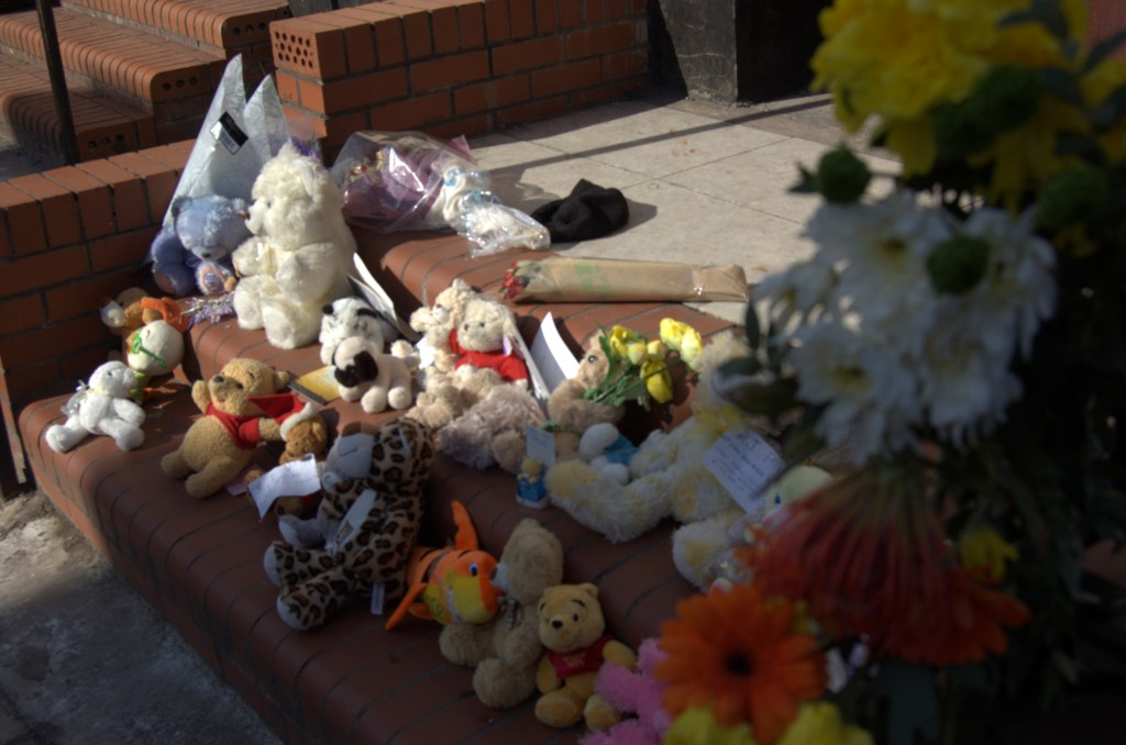 Cuddly toys, flowers and notes left by locals in memory of the baby boy